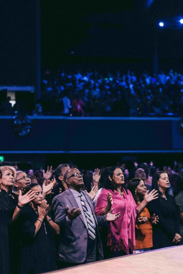 A group of people standing in front of an audience.